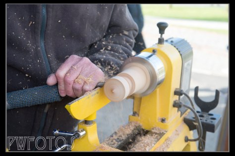 A spinning top being turned on lathe
