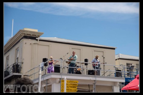 Local band Shenanigans entertain for the balcony of the Empire hotel