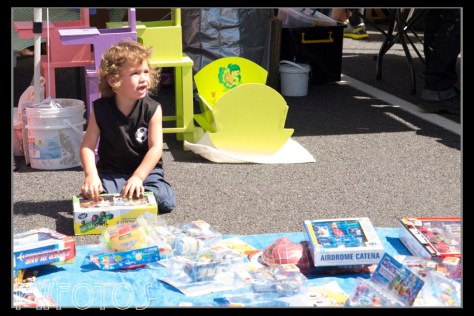 This little guy has found something he really likes in the used toys stall