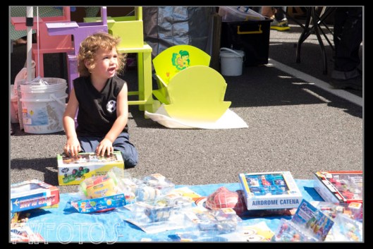This little guy has found something he really likes in the used toys stall