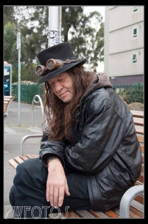 A character in Fitzroy. I say this guy across the street but knew that I did not have enough reach in the lens to shoot as I wanted. So I ant up and asked him if he would mind, and he was cool with it